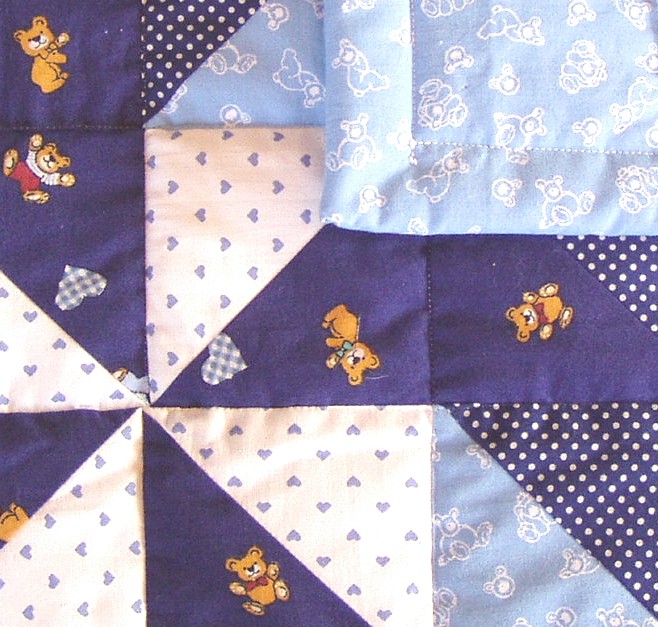 Close-up of quilt stitching and patchwork details.