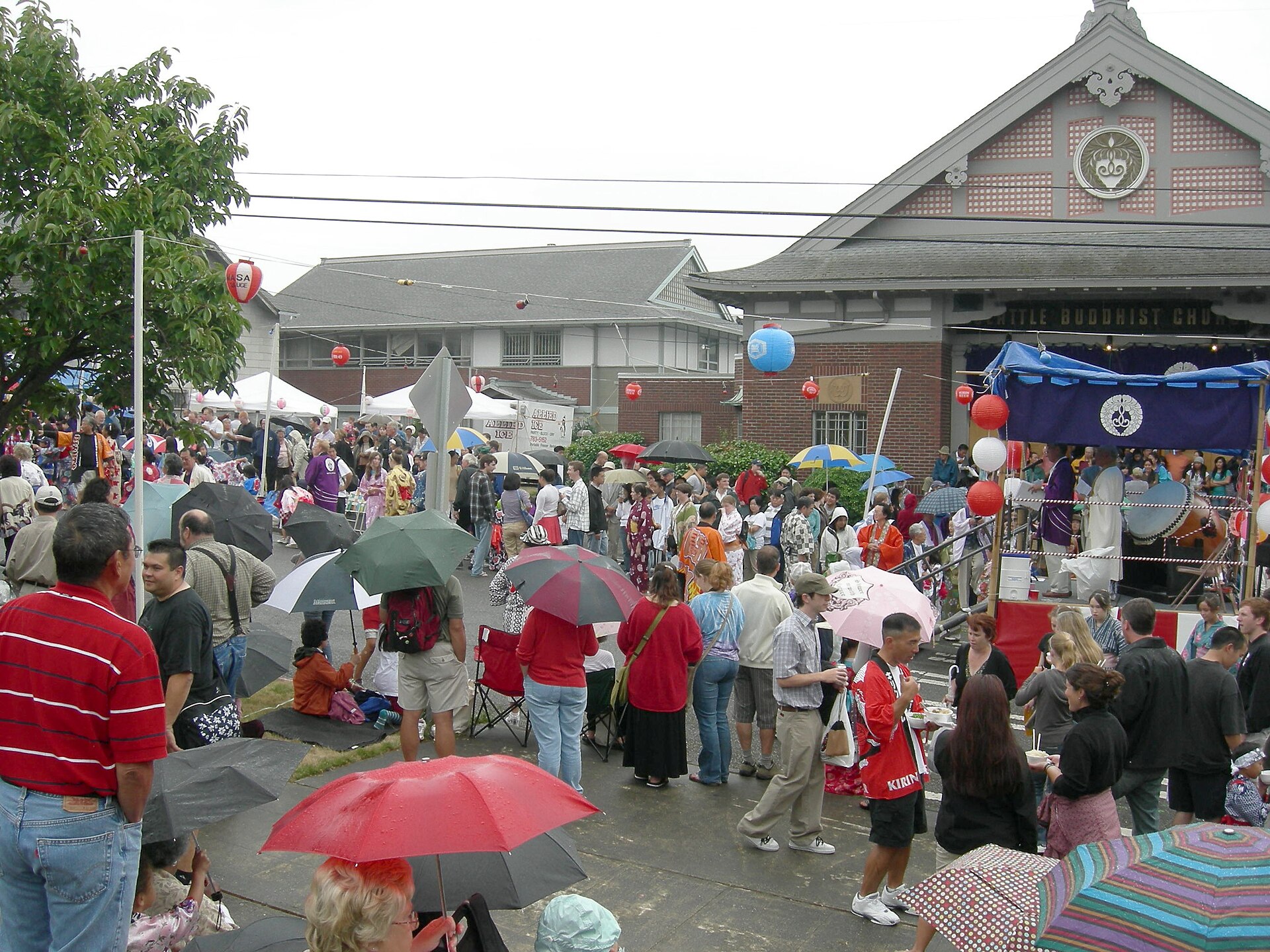 Attendees preparing for weather at a festival.